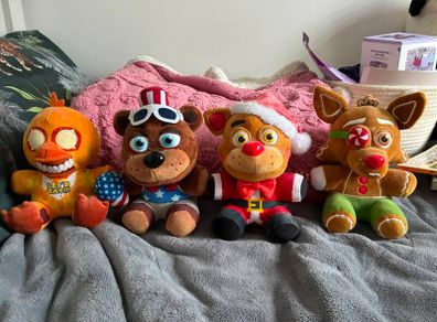 Five Nights at Freddys plushies and dragon figures