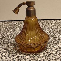 Vintage amber glass perfume atomizer in an Art Deco style