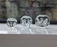 3 x cylindrical glass candle holders.