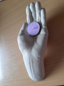 Open hand tea light holder