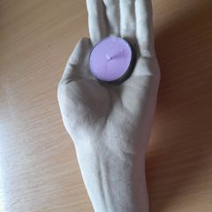 Open hand tea light holder
