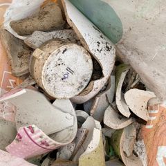 Bag of broken crockery for plant drainage