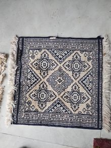 tiny wool rug...small mark on fringe.