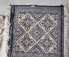 tiny wool rug...small mark on fringe.