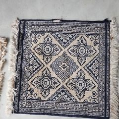 tiny wool rug...small mark on fringe.