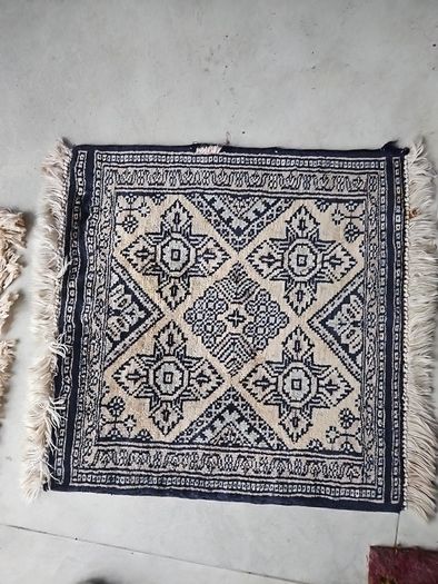 tiny wool rug...small mark on fringe.