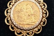 Full sovereign coin mounted in 9ct yellow gold pendant