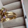 The ring has a unique stacked design with several bands and beautiful pastel/coloured stones, including purple, green and champagne tones. The hallmark has worn away over time, but the ring was tested today and confirmed as genuine 14K gold weight 3.95g. Image 5