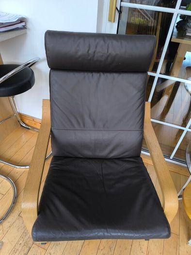 Ikea Poang brown leather chairs and matching footstool with occasional table