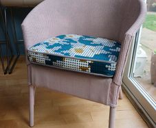 Soft pink Lloyd loom chair