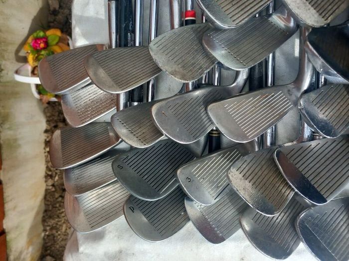 A selection of golf clubs and bags. Golf balls