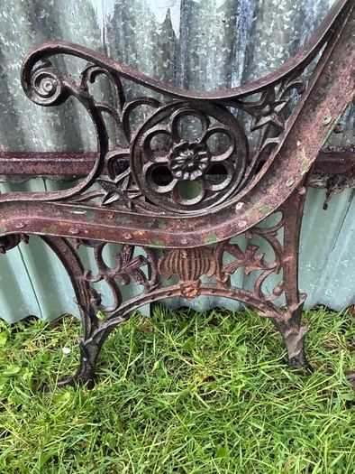 Pair of decorative cast iron bench ends