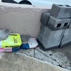 Brand new bricks and bran new bags cement
