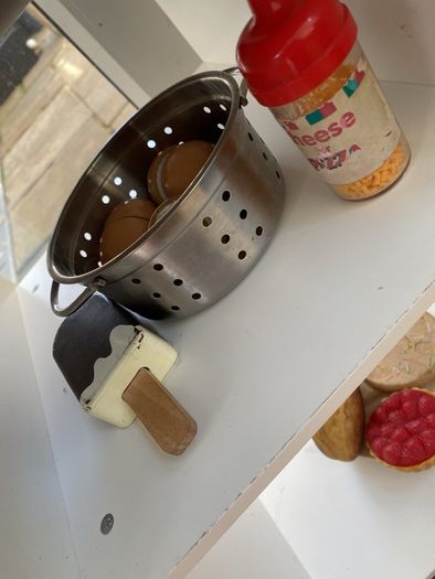 kids play kitchen by Plum with wooden food accessories