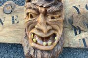 Devil wood carving sign