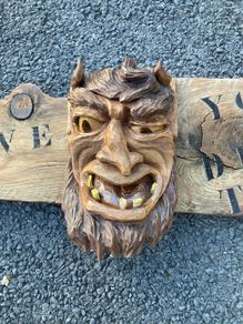 Devil wood carving sign