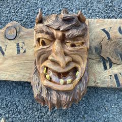 Devil wood carving sign