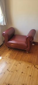Maroon leather armless chair