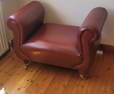 Maroon leather armless chair