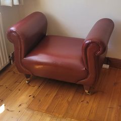 Maroon leather armless chair