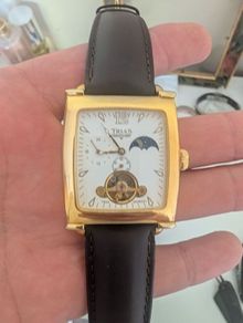 The image shows a Trias men's mechanical watch in a rectangular "tank" case.