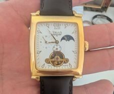 The image shows a Trias men's mechanical watch in a rectangular "tank" case.
