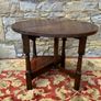 Early 20th Century solid oak gate leg drop leaf table. Image 5