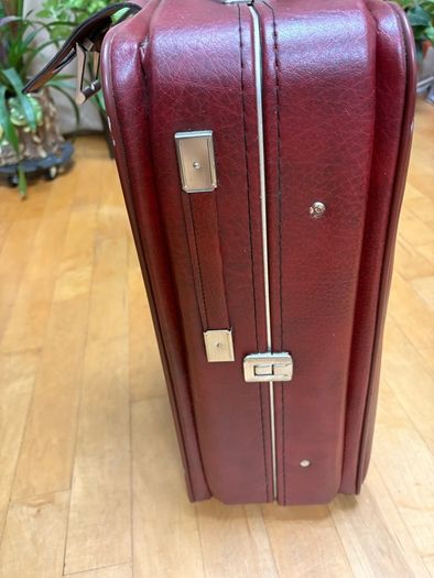 Vintage burgundy faux-leather suitcase