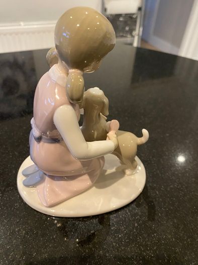 Annie Rowe figure girl brushing dog