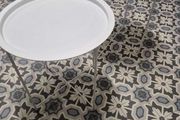 Set of two white round side tables