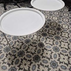 Set of two white round side tables