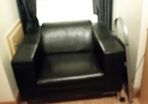 Large black leather armchair in perfect condition. Used only in bedroom.