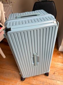 Big blue suitcase with 5 wheels