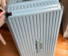 Big blue suitcase with 5 wheels