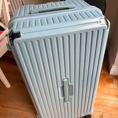 Big blue suitcase with 5 wheels