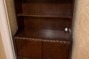 Mahogany bookcase with sliding doors and claw and ball feet