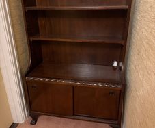 Mahogany bookcase with sliding doors and claw and ball feet