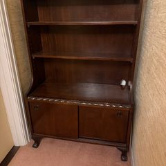 Mahogany bookcase with sliding doors and claw and ball feet