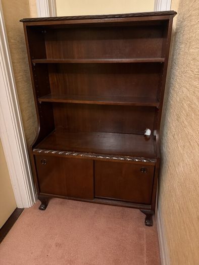 Mahogany bookcase with sliding doors and claw and ball feet