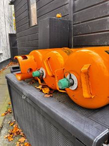 3 empty gas bottles