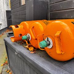3 empty gas bottles
