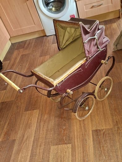 Antique Burgundy Doll's Pram, Manufactured by Walker around the 1940s, It features a Coach-Built Style Carriage with distinctive Wire-Spoke Wheels and Hard Rubber Tires Collection Only