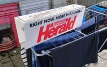 electric news paper sign