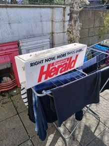 electric news paper sign