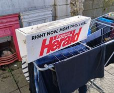 electric news paper sign