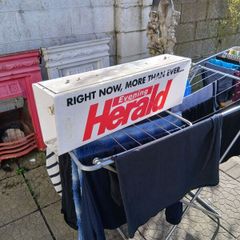 electric news paper sign