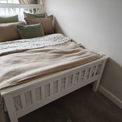 Small double white wooden bed