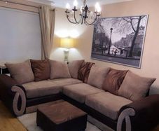 L shaped sofa with footstool