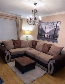L shaped sofa with footstool