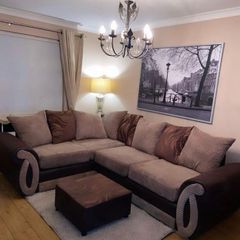 L shaped sofa with footstool